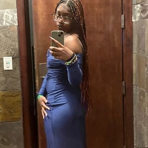 A navy blue, floor length dress